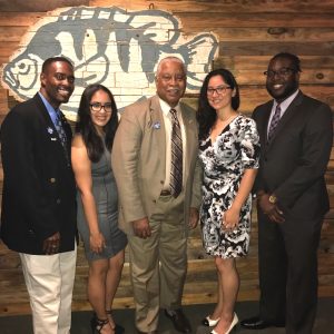 A group poses for a photo at the AEL Honor Society Induction