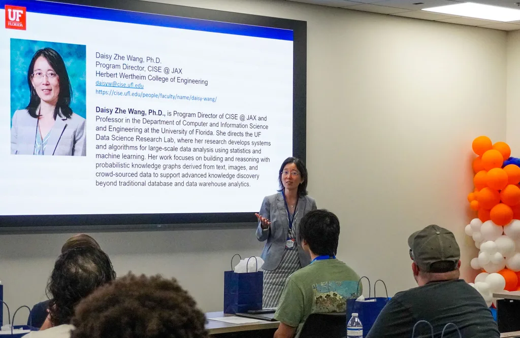 Daisy Zhe Wang speaks to students at the recent orientation at the UF Jacksonville campus.
